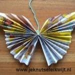Vlinder vouwen van tijdschrift blaadjes